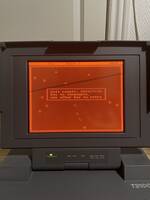 The First Cell running on a Toshiba T3100e with a red gas plasma display